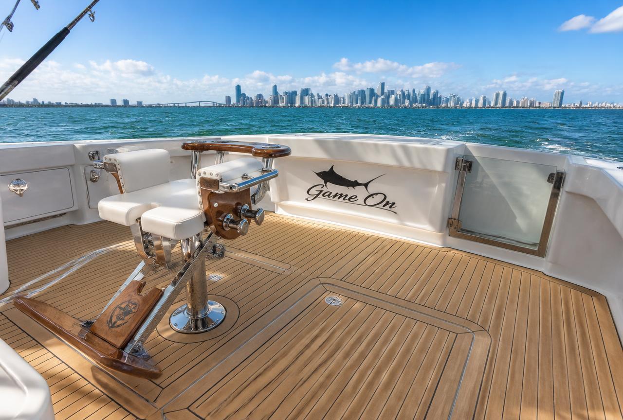 Sportfish boat cockpit with new synthetic teak decking and the Miami skyline behind